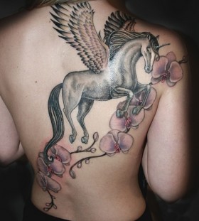 unicorn tatto with flowers on the back