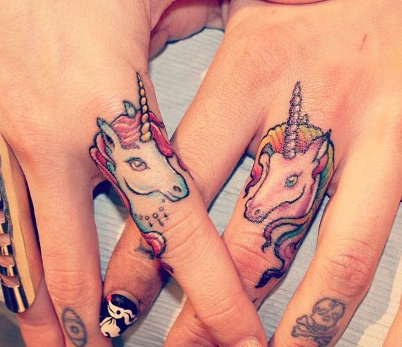 unicorn tattoo on fingers