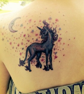 unicorn tattoo with the moon on the back