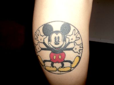 Adorable black and white Mickey Mouse tattoo on leg