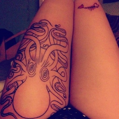 Adorable black women’s octopus tattoo on leg