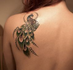 Adorable blue peacock tattoo on shoulder