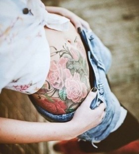 Adorable flowers girl tattoo on hip