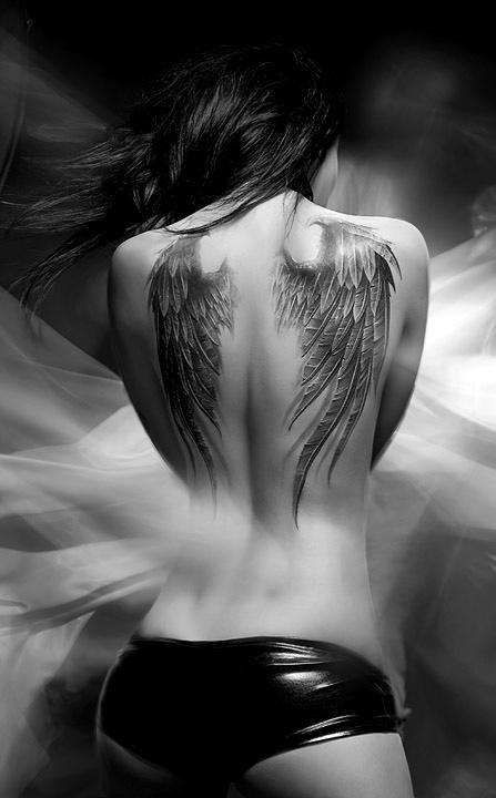 Adorable girl’s angel tattoo on shoulder