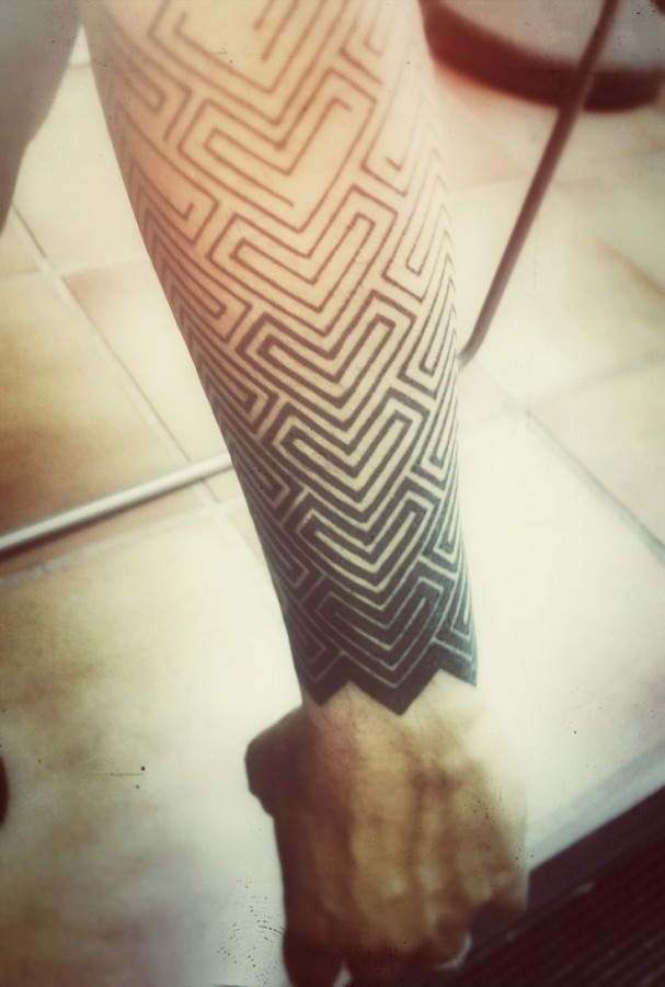 Amaizing black geometric arm tattoo