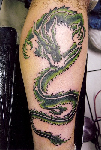 Amazing dragon green tattoo