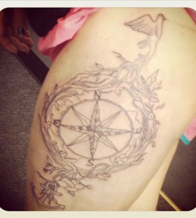 Anchor ornaments compass tattoo on leg