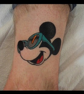 Awesome glass and Mickey Mouse tattoo on leg