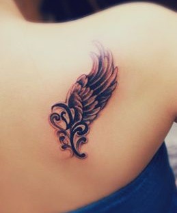 Awesome looking black angel tattoo on shoulder
