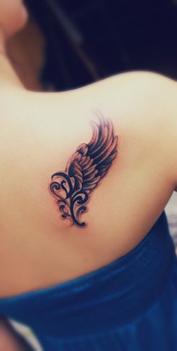 Awesome looking black angel tattoo on shoulder