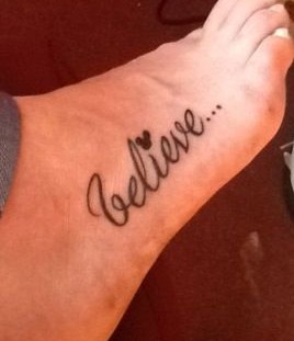 Believe quote Mickey Mouse tattoo on leg