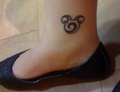 Black adorable Mickey Mouse tattoo on leg