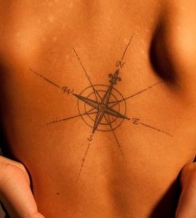 Black adorable compass tattoo on back
