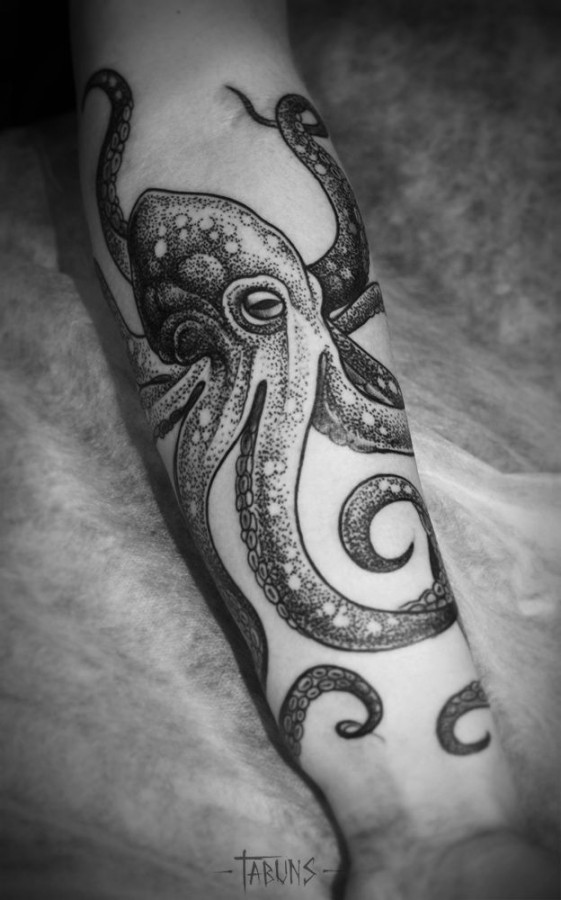 Black amazing octopus tattoo on arm