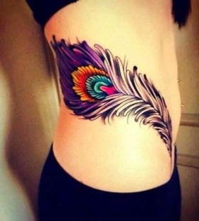Black and purple girl tattoo on hip