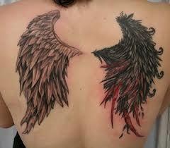 Black and red angel tattoo on shoulder