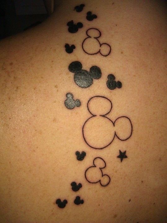 Black and white Mickey Mouse tattoo on arm