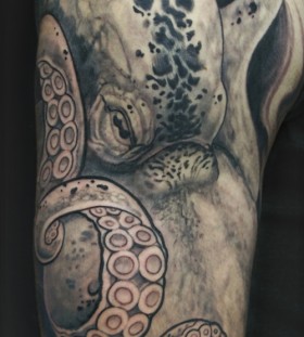 Black and white octopus tattoo on arm