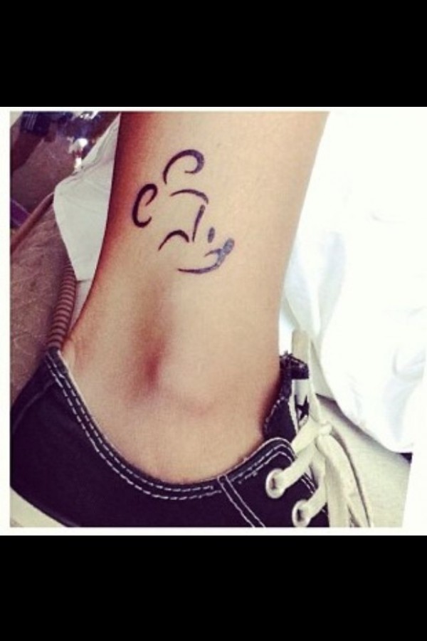 Black cute Mickey Mouse tattoo on leg