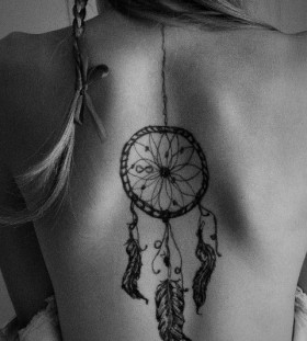 Black feather and dreamcatcher tattoo
