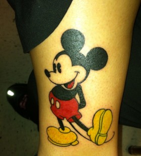 Black funny Mickey Mouse tattoo on leg