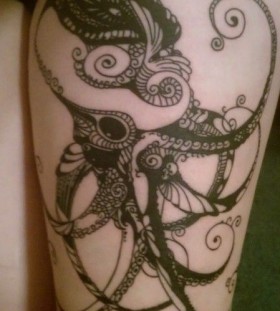 Black lace and octopus tattoo on leg