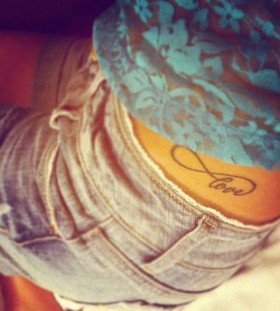 Black love girl tattoo on hip