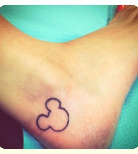 Black lovely Mickey Mouse tattoo on leg