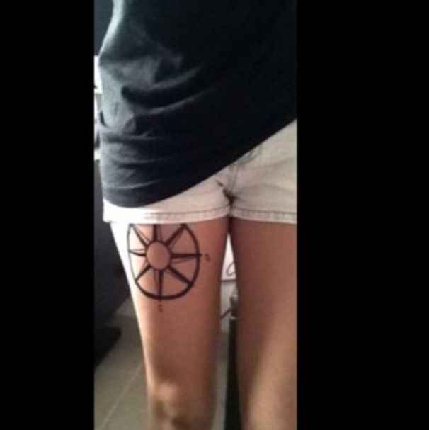 Black lovely compass tattoo on leg