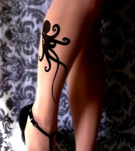 Black lovely octopus tattoo on leg