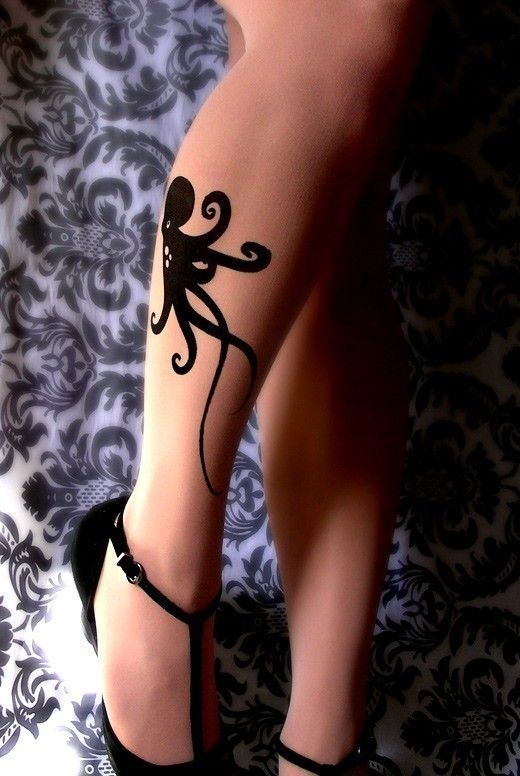 Black lovely octopus tattoo on leg