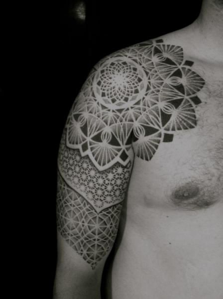 Black men’s geometric shoulder, back tattoo