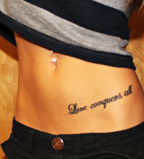 Black quote girl tattoo on hip