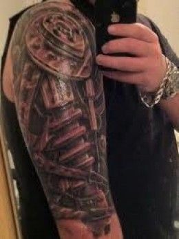 Black shoulder robbot tattoo