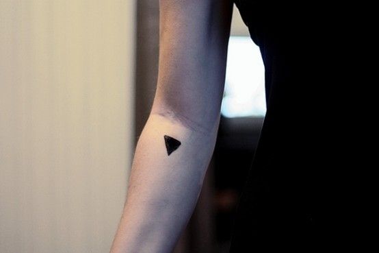 Black small geometric arm tattoo