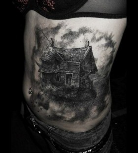 Black wolf's and house tattoo