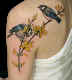 Blue birds and yellow tattoo