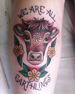 Brown black cow tattoo