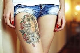 Brown owl compass tattoo on leg