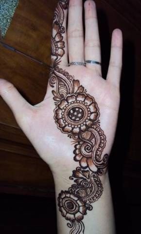 Brown round Henna and Mehndi design tattoo