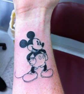 Cool hand's Mickey Mouse tattoo on arm