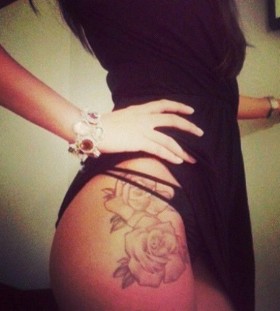 Cool looking roses girl tattoo on hip
