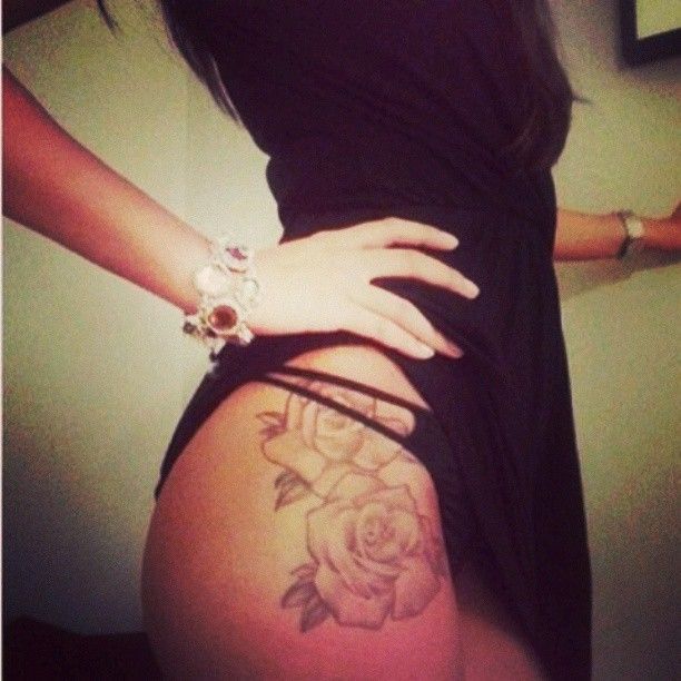 Cool looking roses girl tattoo on hip
