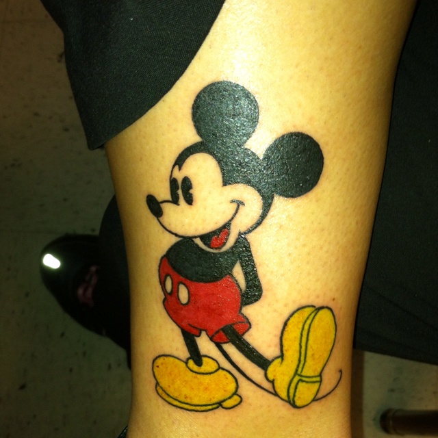 Cool smile Mickey Mouse tattoo on arm