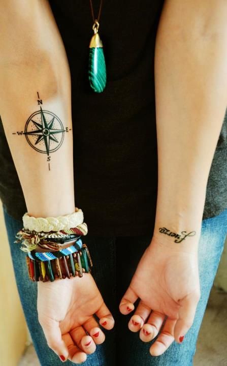 Cute girl’s compass tattoo on arm