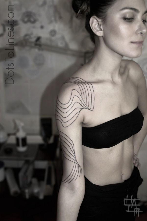 Cute looking girl geometric shoulder, back tattoo