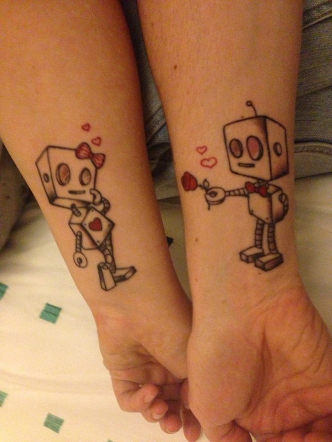 Cute red girl and boy robbot tattoo