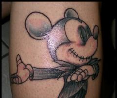 Dancing cruel Mickey Mouse tattoo on leg