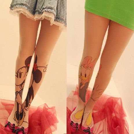 Funny duck and Mickey Mouse tattoo on leg