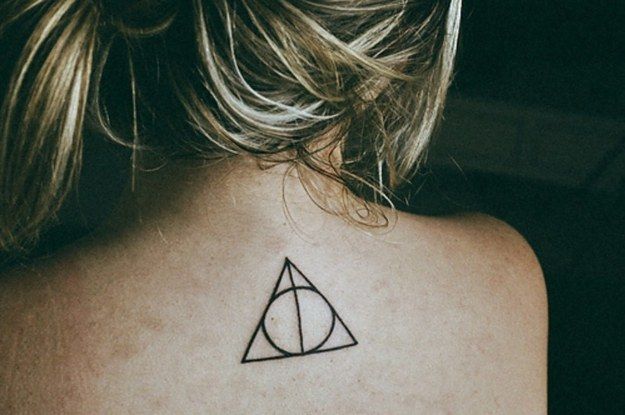 Girl’s back Harry Potter tattoo